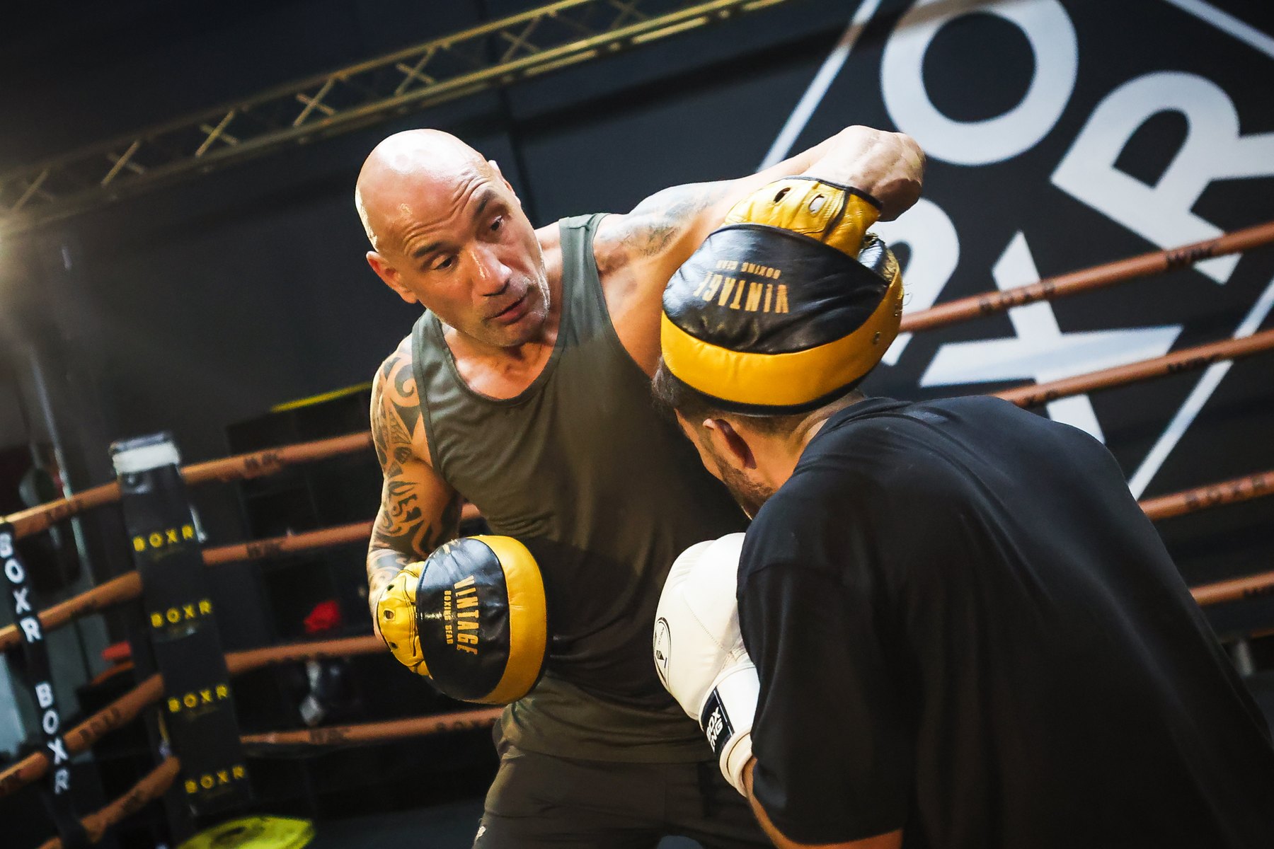 Donato De Martiis working mitts with a fighter