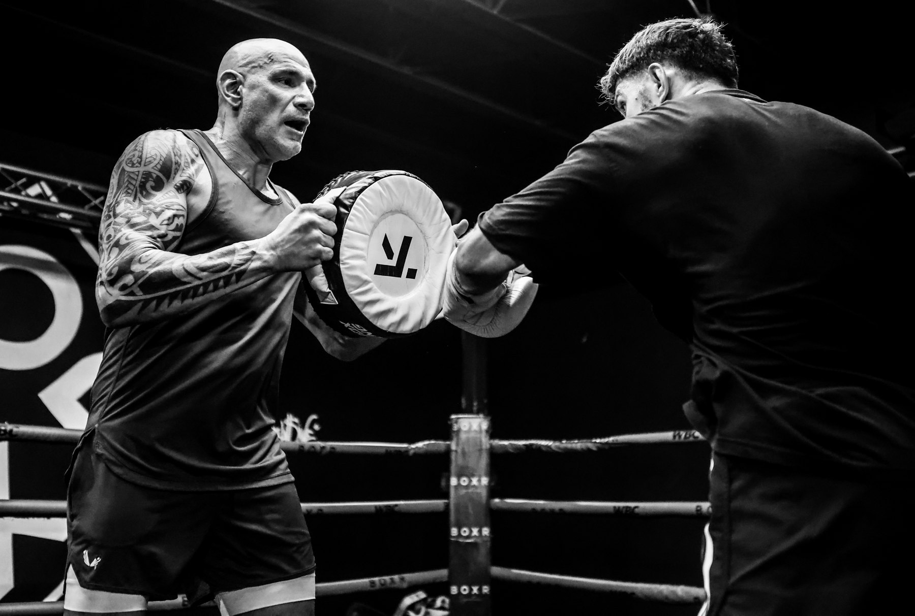 Donato De Martiis holding pads for a fighter in a Miami ring
