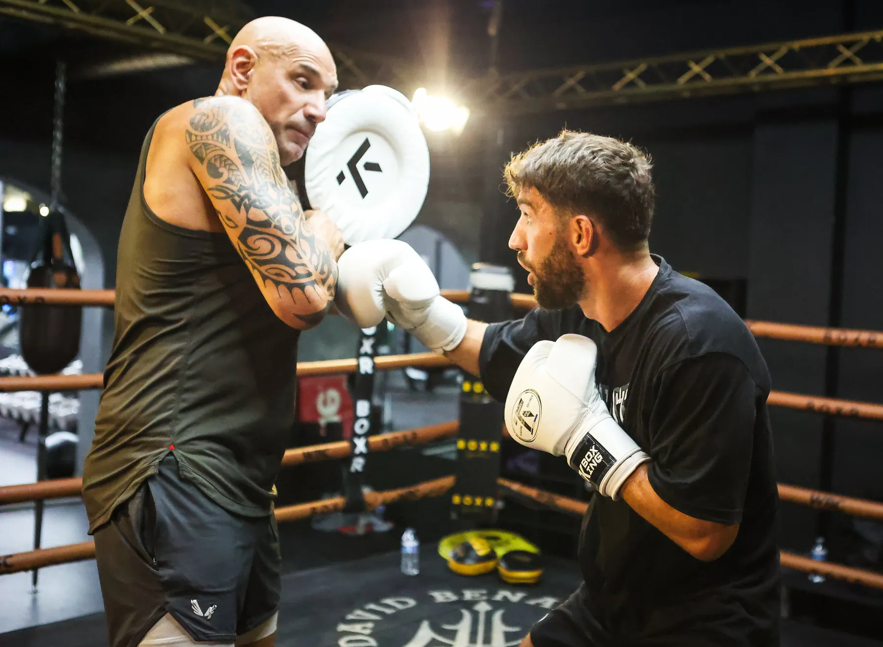 Ringside corner work during a professional fight camp