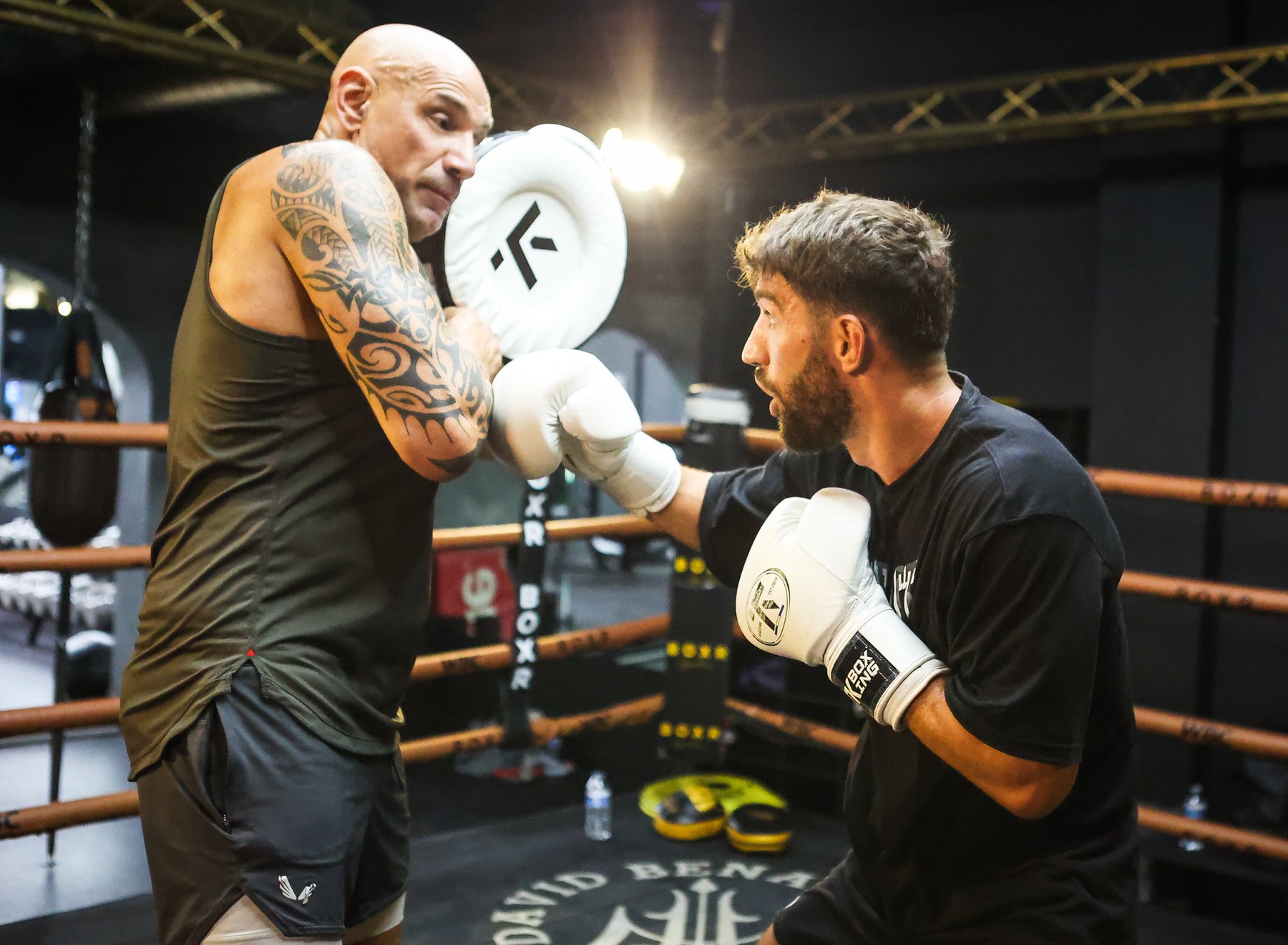 Ringside corner work during a professional fight camp